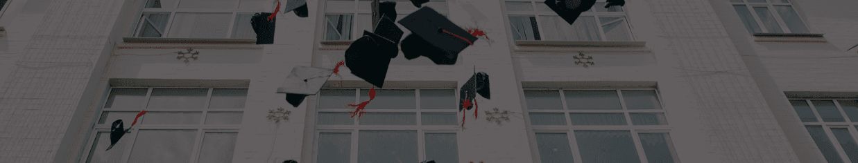 admission image with graduating throwing up caps